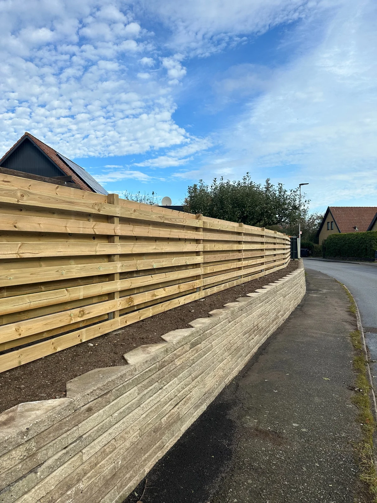 Completed retaining wall and timber fence